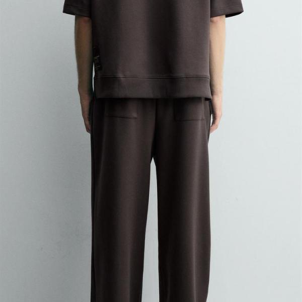INTERLOCK PLEATED LABEL TROUSERS
