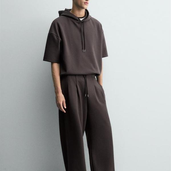 INTERLOCK PLEATED LABEL TROUSERS